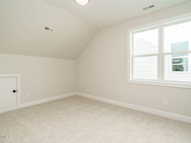 205 Wash Hollow Dr, Wendell, NC 27591 - additional living space with vaulted ceiling and carpet floors