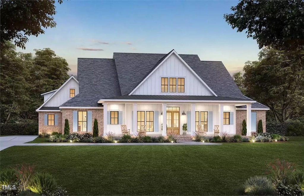 6604 Deermont Ct, Gibsonville, NC 27249 - view of front facade featuring covered porch and a yard
