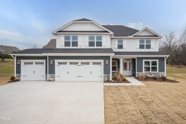 craftsman-style home featuring a front yard and a garage