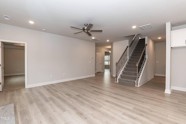 unfurnished living room with ceiling fan and light wood-type flooring