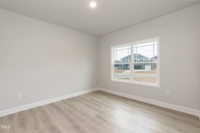 unfurnished room featuring light hardwood / wood-style flooring