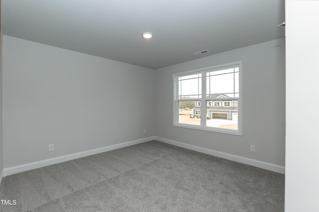 empty room with light colored carpet