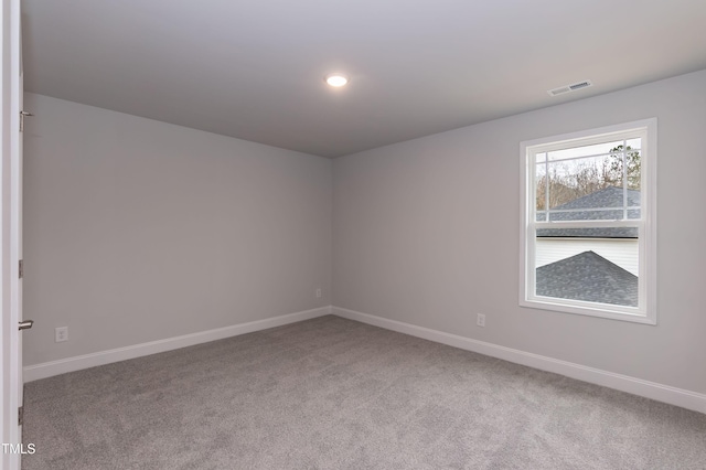 spare room featuring carpet floors