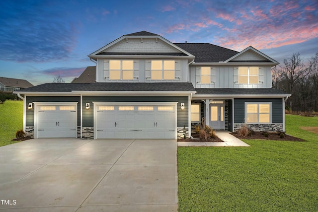 craftsman inspired home with a lawn and a garage