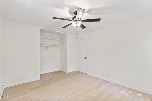 unfurnished bedroom with a closet, ceiling fan, and light wood-type flooring