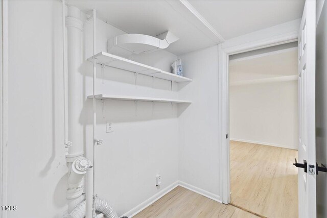 washroom with light hardwood / wood-style floors