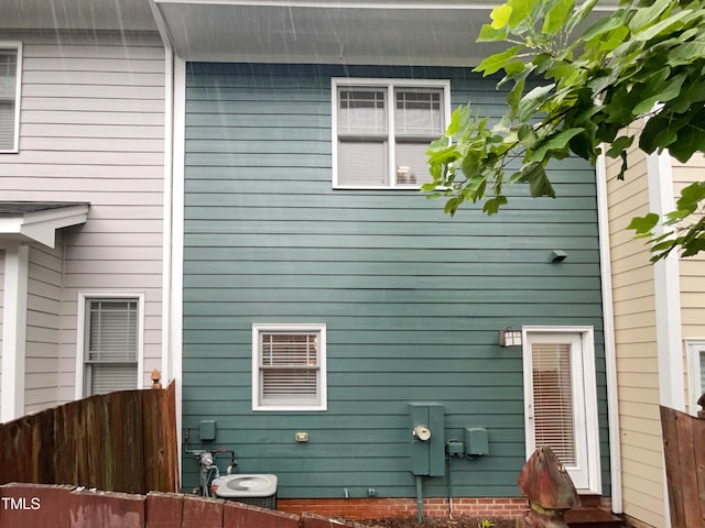 view of side of home featuring central AC unit