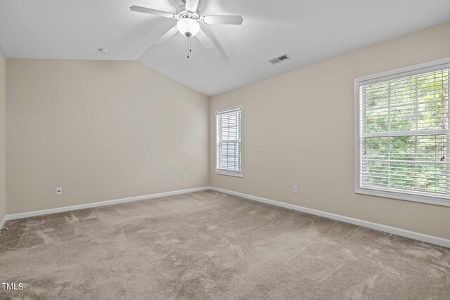 unfurnished room with vaulted ceiling, carpet, and ceiling fan