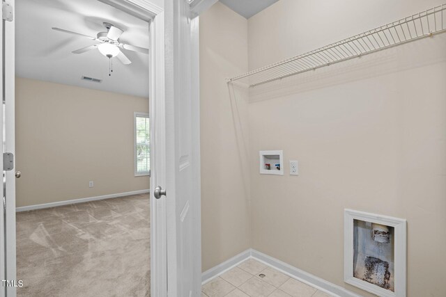 clothes washing area featuring light carpet, washer hookup, and ceiling fan