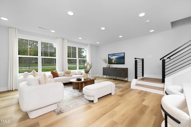 living room with light hardwood / wood-style floors