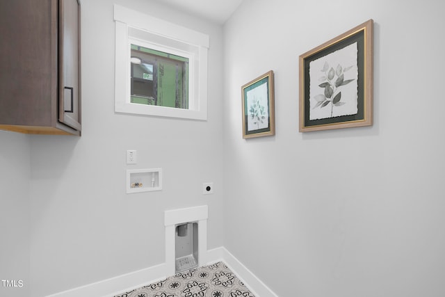 washroom featuring washer hookup, light tile patterned flooring, cabinets, and hookup for an electric dryer