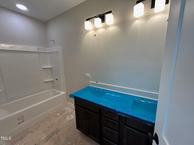 bathroom featuring vanity and tub / shower combination