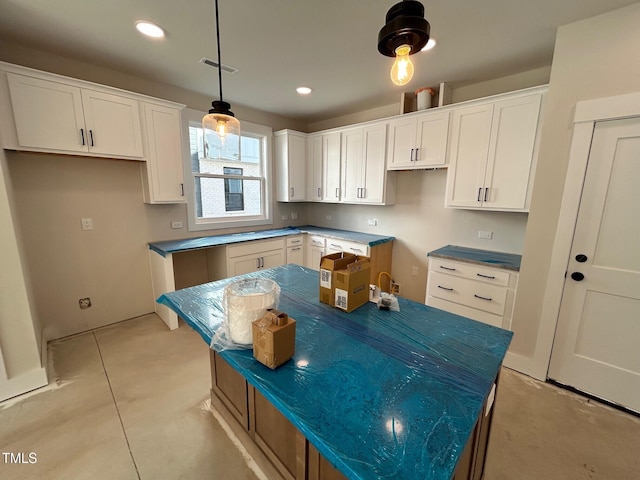 kitchen with white cabinetry and a kitchen island