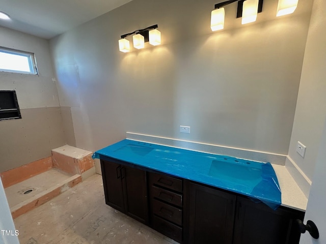 bathroom with concrete floors