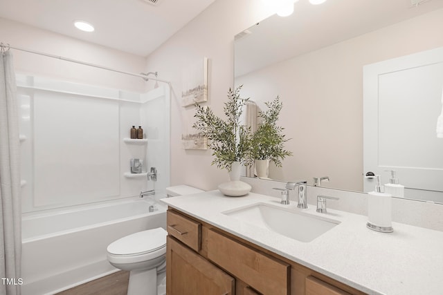 full bathroom with hardwood / wood-style flooring, toilet, vanity, and  shower combination