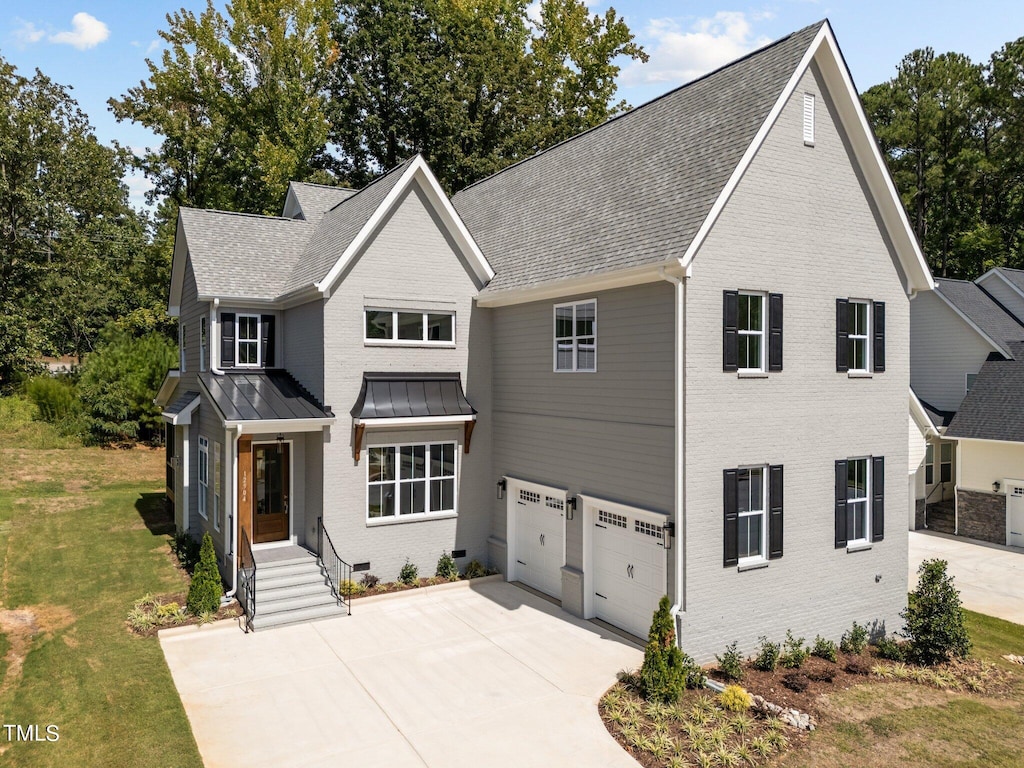 view of front of house featuring a garage and a front yard