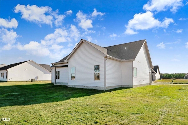 rear view of house with a yard