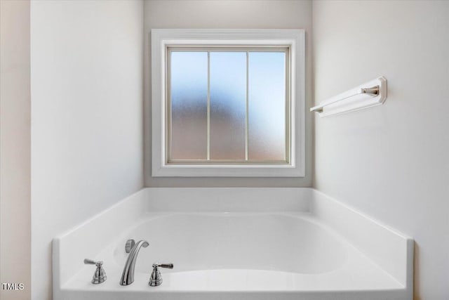 bathroom with a garden tub