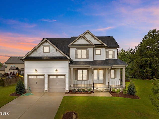 craftsman-style home featuring covered porch and a yard