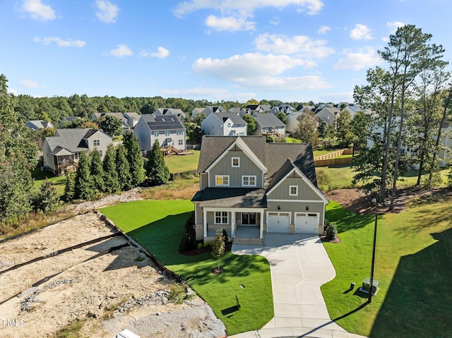 view of front of house with a garage and a front lawn