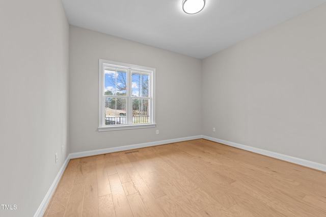 spare room with light wood-type flooring