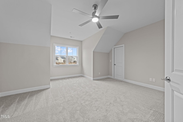 bonus room featuring ceiling fan, light colored carpet, and lofted ceiling