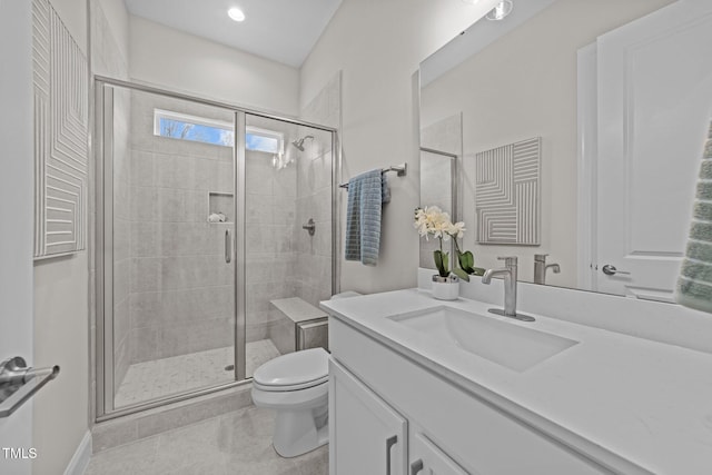 bathroom featuring walk in shower, tile patterned floors, vanity, and toilet