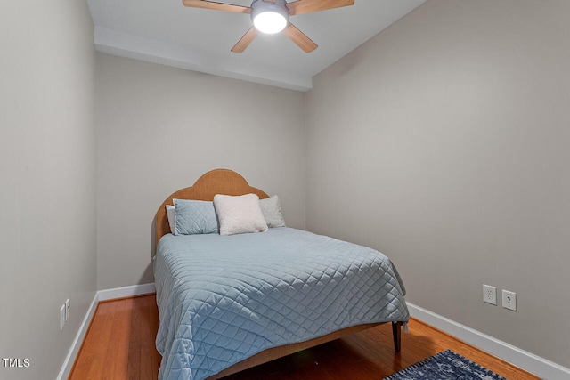 bedroom with wood-type flooring and ceiling fan