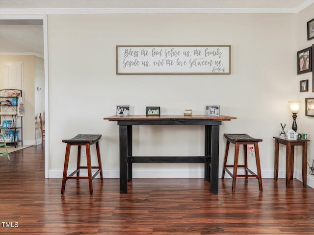 details with hardwood / wood-style flooring and ornamental molding