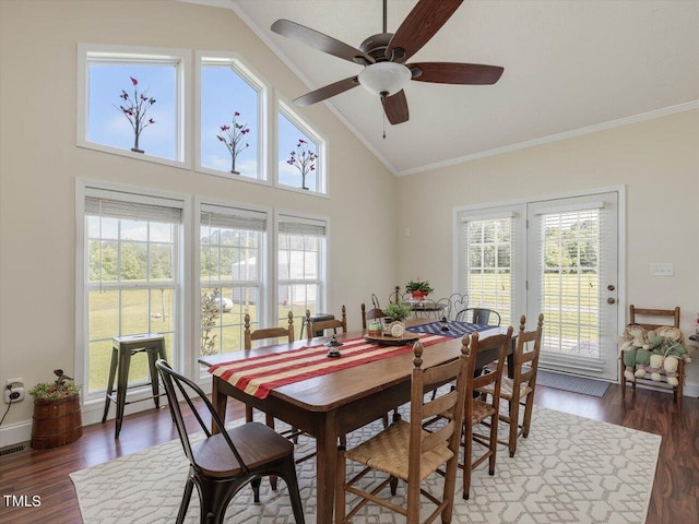 dining area featuring ceiling fan, ornamental molding, dark hardwood / wood-style flooring, and high vaulted ceiling