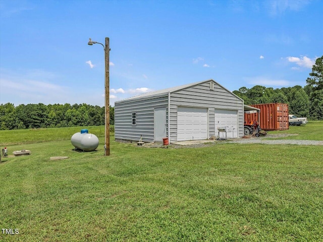 garage with a yard