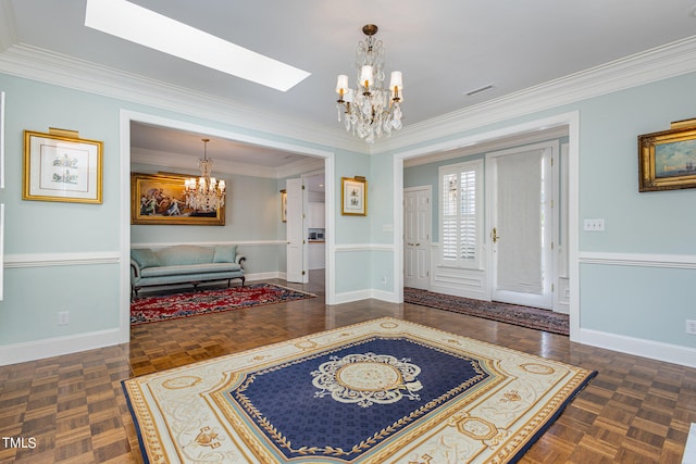 entryway featuring a skylight, dark parquet flooring, a notable chandelier, and crown molding