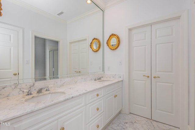 bathroom with dual vanity, tile patterned floors, and ornamental molding