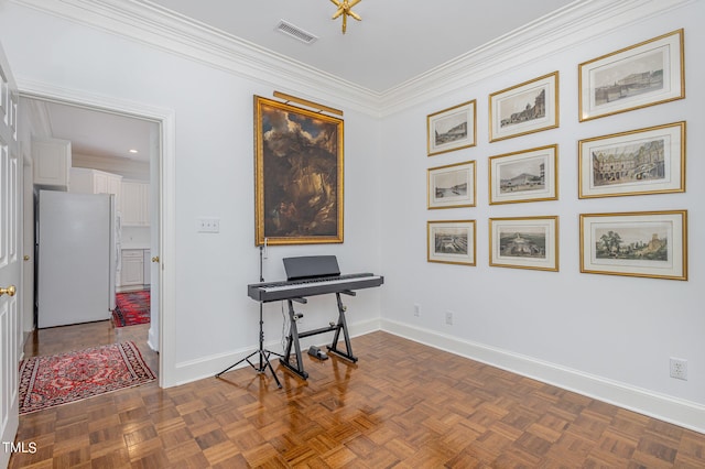 miscellaneous room with ornamental molding and dark parquet floors