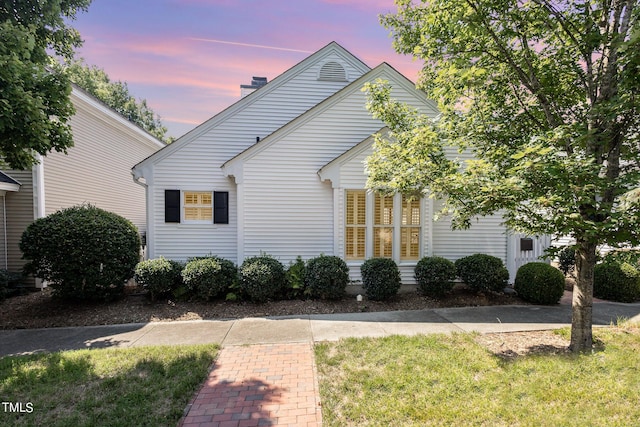 view of front of property with a chimney