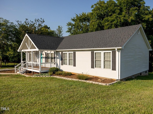 view of front of property with covered porch and a front yard