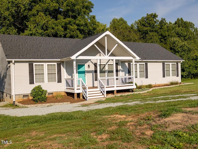 ranch-style home with covered porch and a front lawn