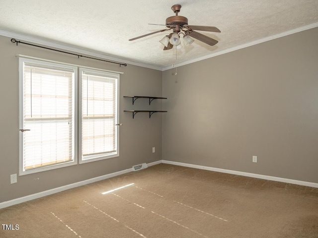 unfurnished room featuring carpet floors, a textured ceiling, crown molding, and ceiling fan