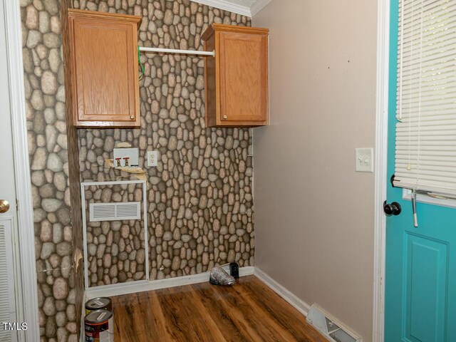 washroom with dark hardwood / wood-style floors and crown molding