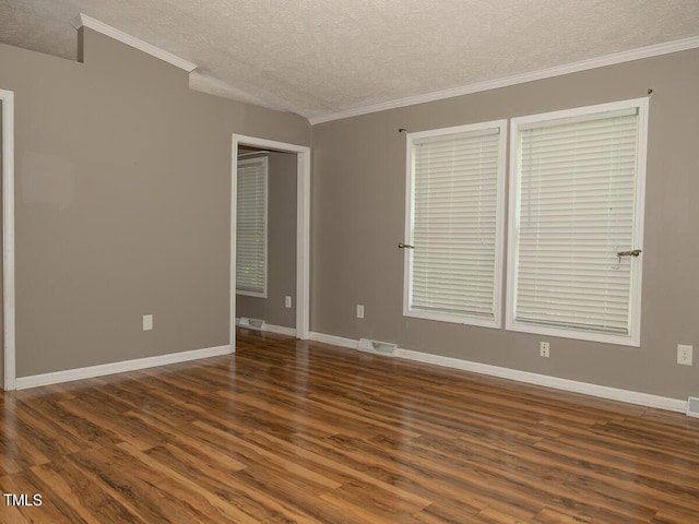 unfurnished room with dark wood-type flooring, a textured ceiling, and ornamental molding