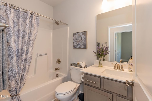 bathroom with toilet, shower / bath combo, and vanity