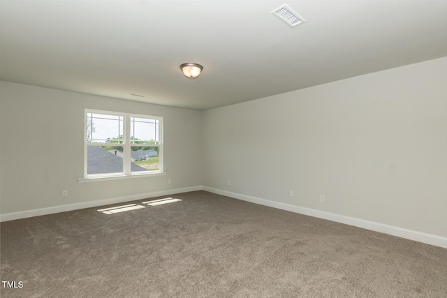 unfurnished room featuring carpet flooring