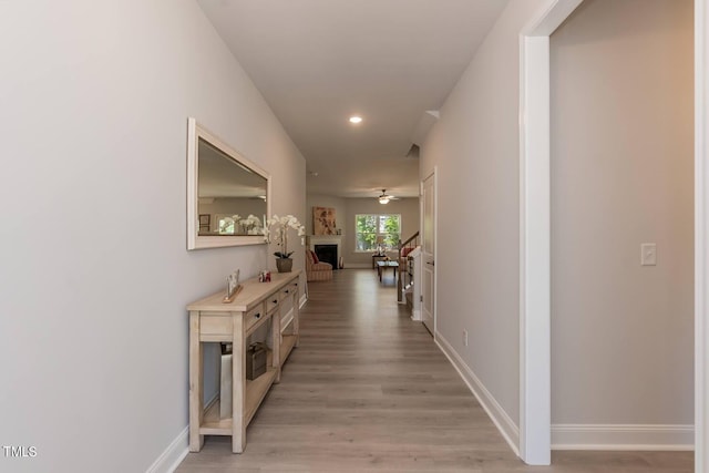 corridor featuring light hardwood / wood-style flooring