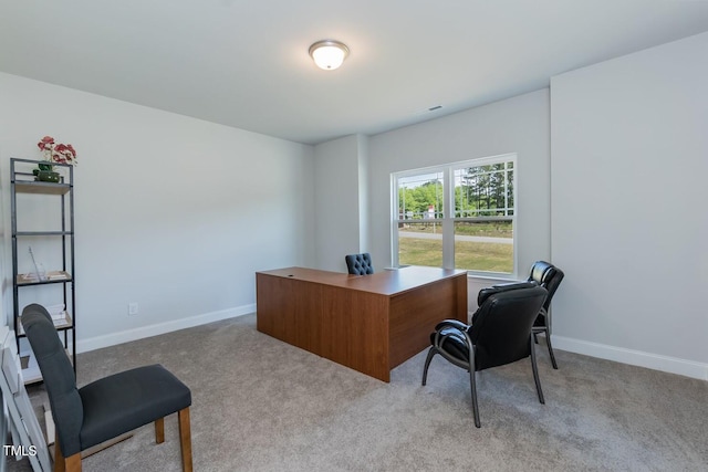 office space with carpet and baseboards