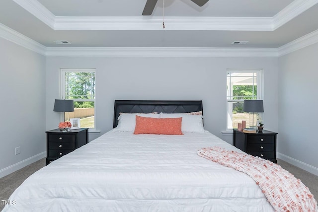 bedroom featuring dark colored carpet, ceiling fan, and crown molding