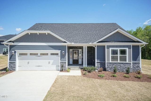 157 Newport Lndg Lot 95, Garner, NC 27529 - craftsman house with stone siding, an attached garage, driveway, and covered porch
