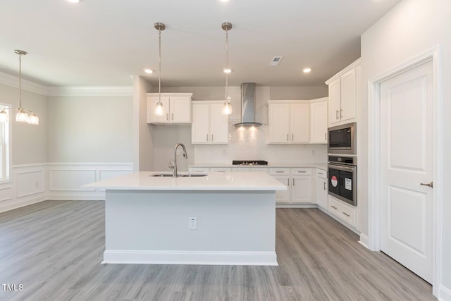 157 Newport Lndg Lot 95, Garner, NC 27529 - kitchen featuring stainless steel oven, wall chimney range hood, a sink, built in microwave, and cooktop