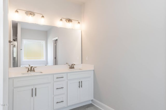 157 Newport Lndg Lot 95, Garner, NC 27529 - bathroom featuring double vanity and baseboards