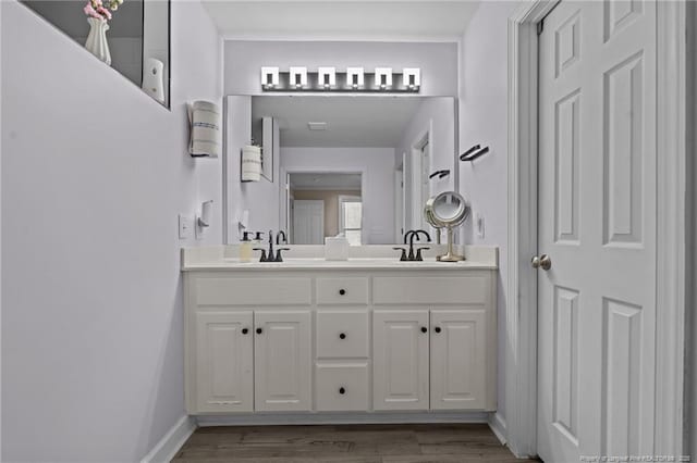 bathroom featuring vanity and wood-type flooring