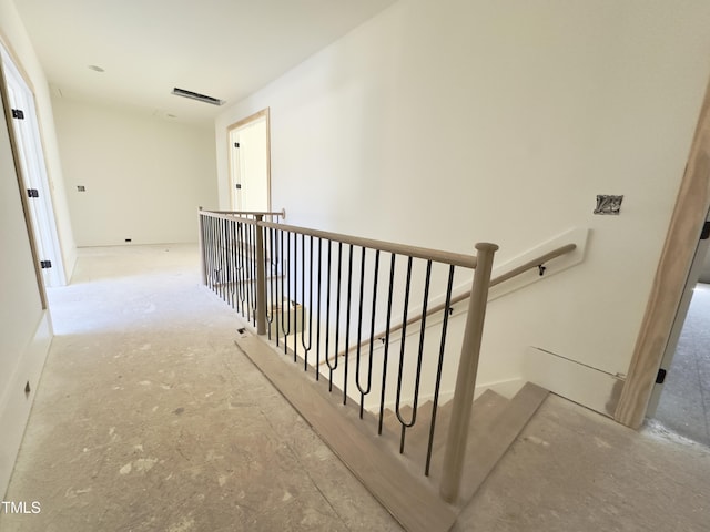 hallway featuring an upstairs landing